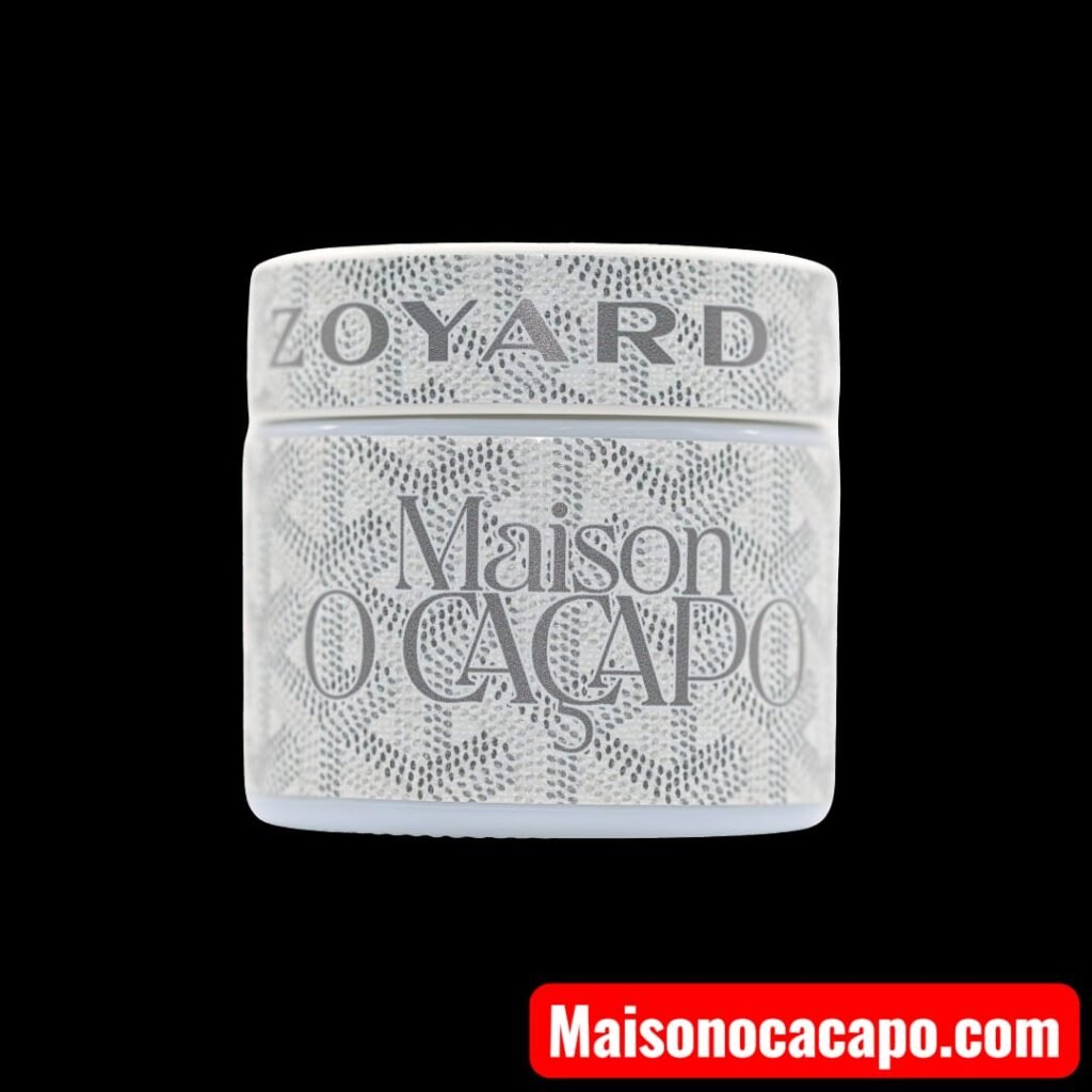 Maison O Caçapo Zoyard Off‑White jar featuring luxury geometric pattern and silver typography, symbolizing Paris‑Fornia couture cannabis design.