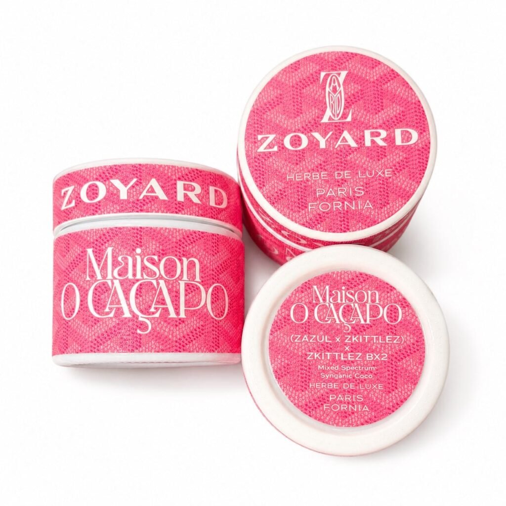 Maison O Caçapo Zoyard Pink luxury cannabis packaging featuring a vibrant pink designer-inspired motif, (Zazul x Zkittlez) x Zkittlez BX2 lineage, and Herbe De Luxe Paris-Fornia branding