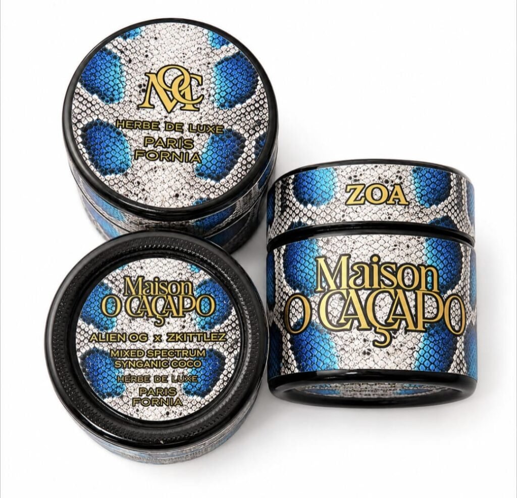 Maison O Caçapo Zoa luxury cannabis packaging featuring a striking blue snakeskin pattern, Alien OG x Zkittlez lineage, and Herbe De Luxe Paris-Fornia branding.