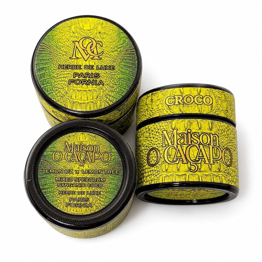 Maison O Caçapo Croco luxury cannabis packaging featuring a bold yellow and green crocodile skin texture, Lemon Oz x Lemon Tree lineage, and Herbe De Luxe Paris-Fornia branding.